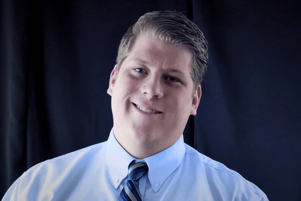 face photo of Lukas E. Fullem tilting his head and smiling